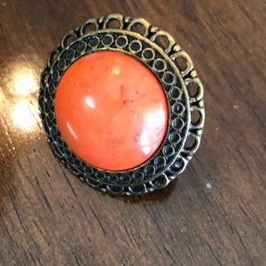 Large circular “stone and metal” ring